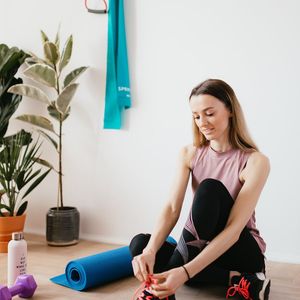Close-up of a yoga mat and a water bottle.